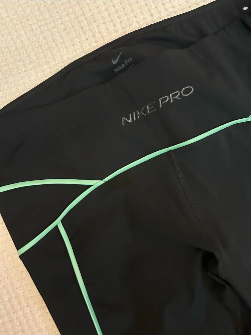 Nike Women's Black Capri Leggings with Mint Trim